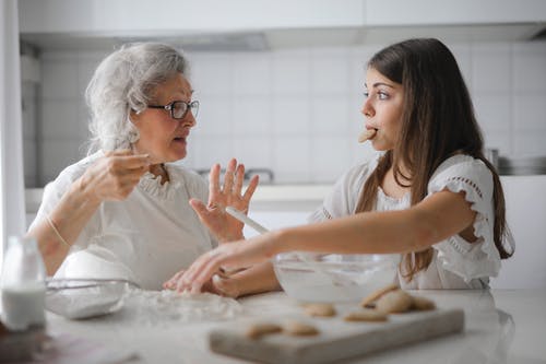 Old woman and child eating cookie